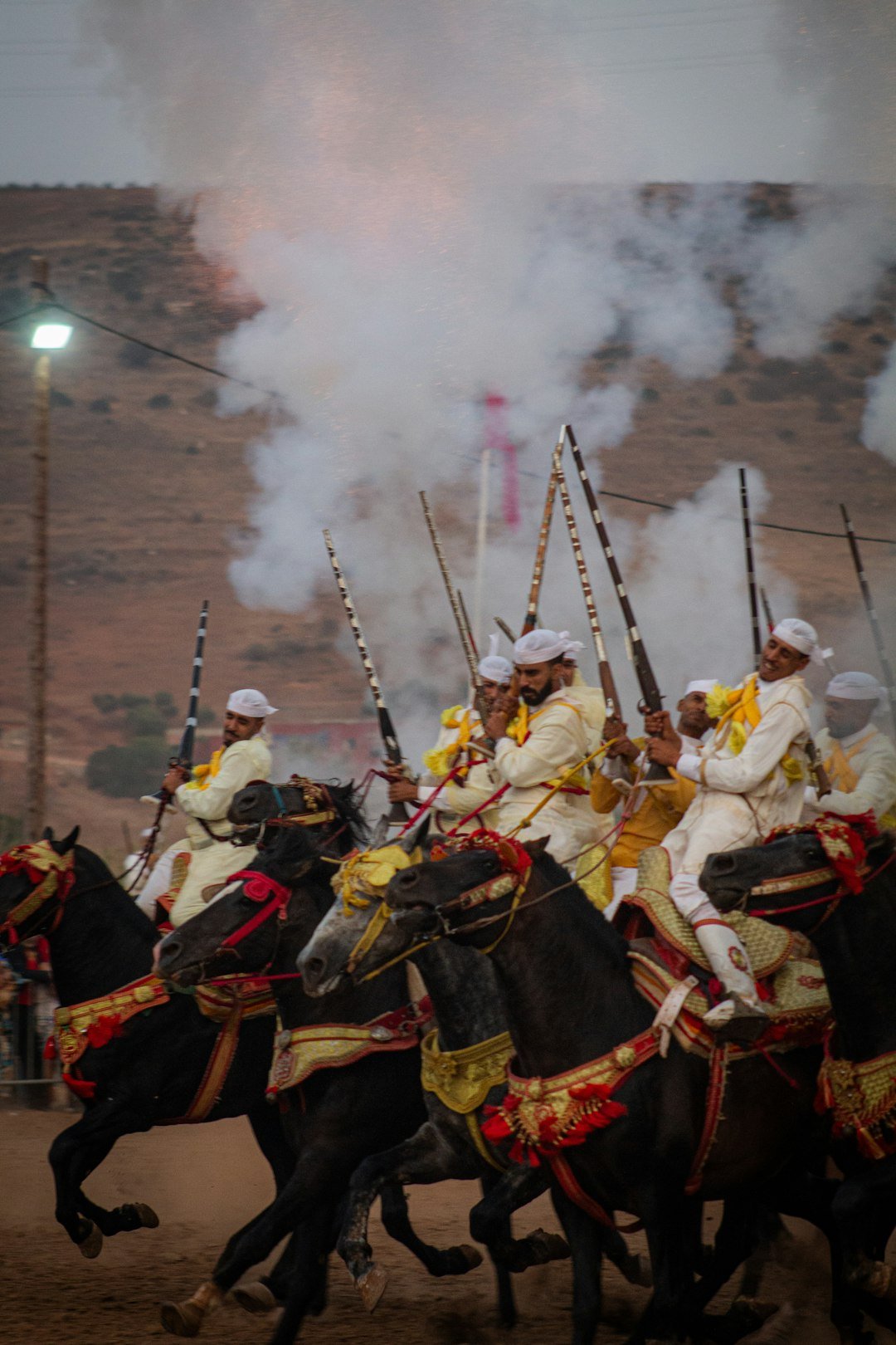gallery-04 Moroccan Tbourida is a thrilling equestrian spectacle that highlights the mastery of Moroccan horsemen in riding and group coordination. Riders perform breathtaking displays, firing antique guns in unison, while wearing traditional costumes that embody Moroccos deep-rooted culture and history.