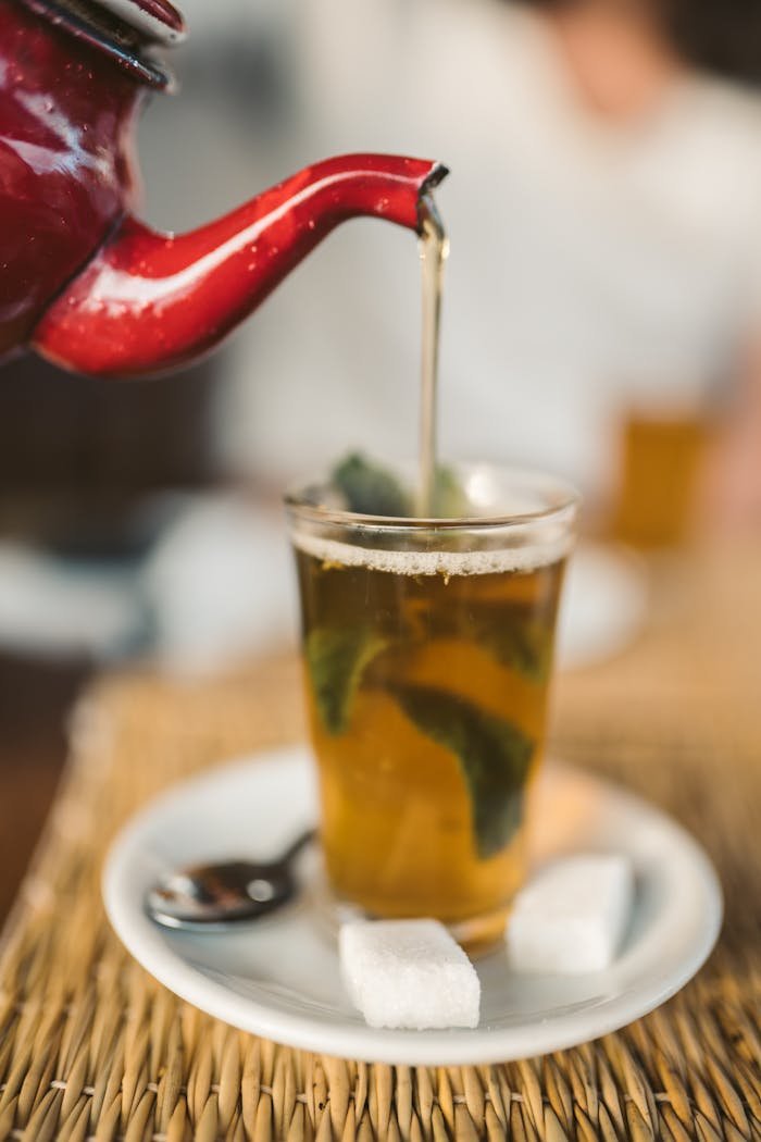 Crafting Captivating Headlines: Your awesome post title goes here Close-up of Moroccan mint tea served with sugar cubes on a saucer.