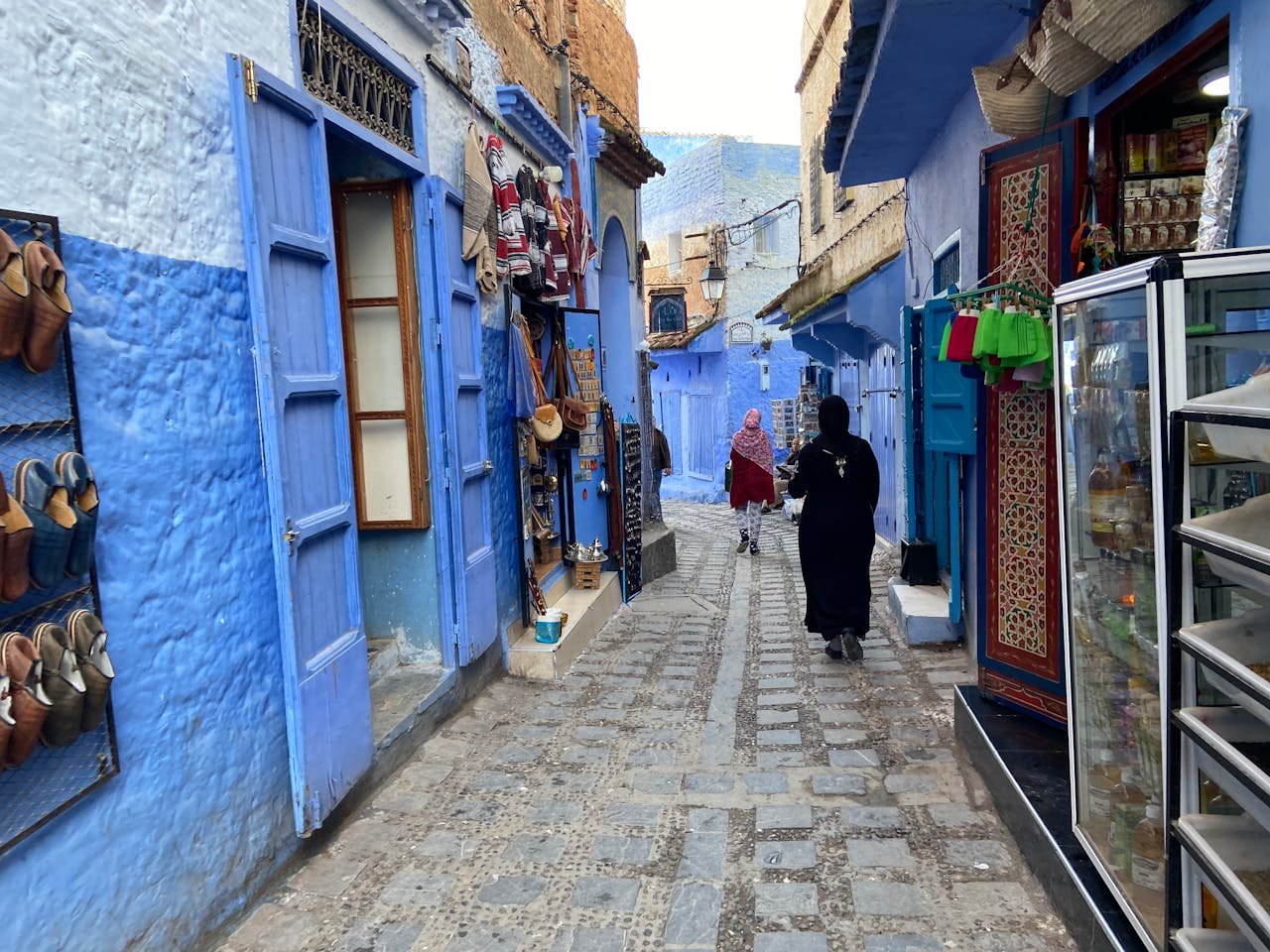 Discover the iconic blue streets of Chefchaouen, Morocco, filled with local culture and charm.