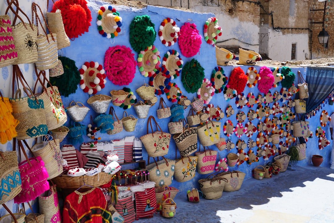 colorful-woven-bags-and-decorations-displayed-on-blue-wall-hvllmicco1w