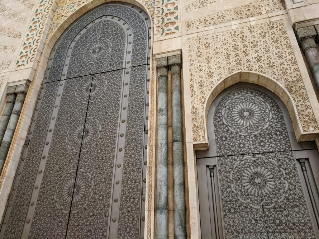 Home Close-up of intricate Moroccan geometric patterns on a mosque door.